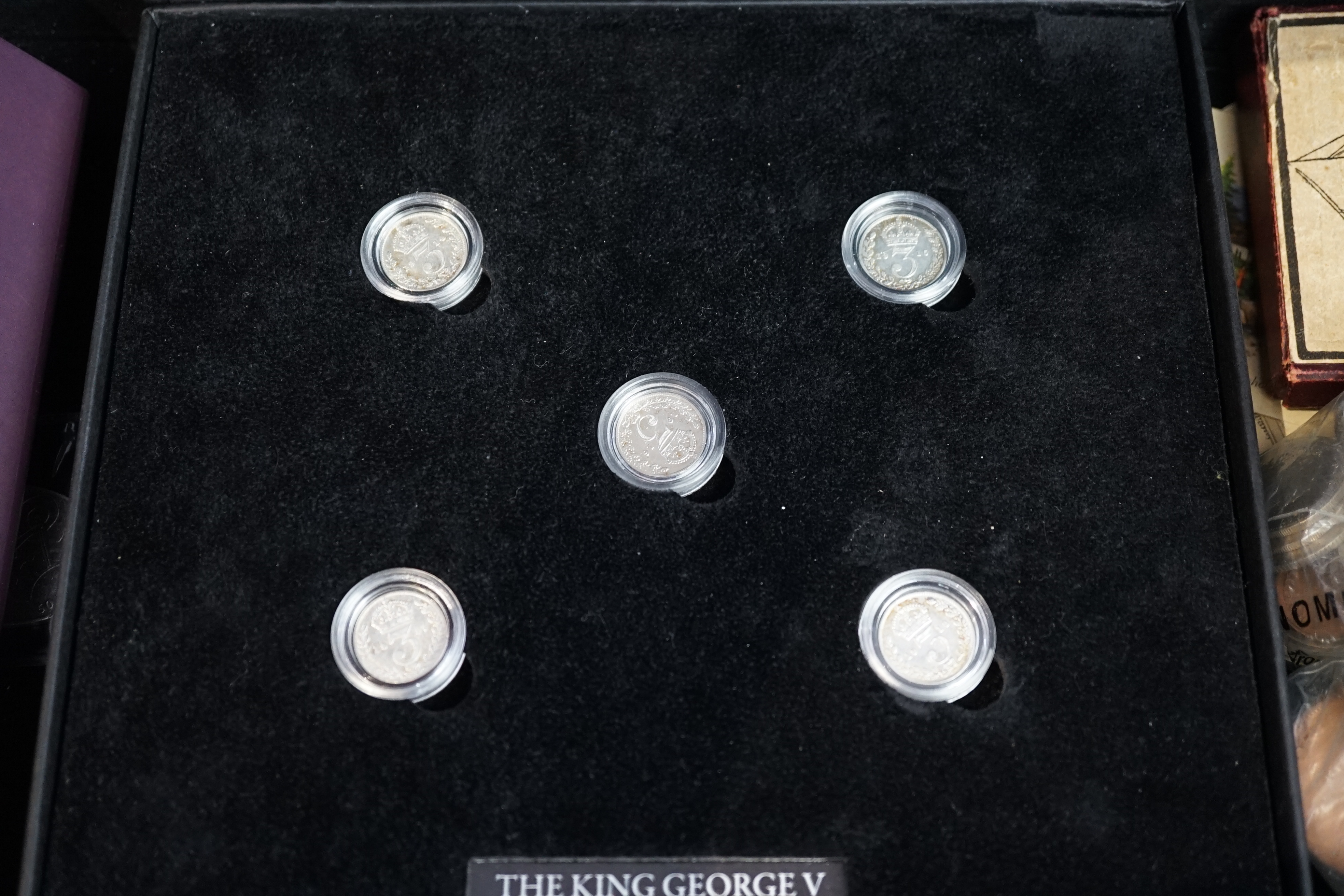 British coins, 1953 coronation coin and commemorative stamp set issued by Jubilee Mint, George V First World War maundy silver threepence set, issued by Bradford Exchange, a Bailiwick of Jersey £5, 2016 and Isle of Man o
